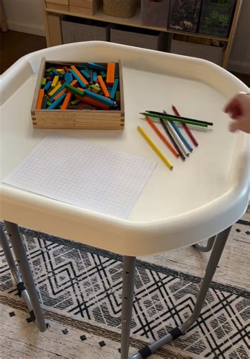 Color Block Art Invitation 🎨✨ A simple open-ended activity where kids make pictures and patterns using colorful blocks on grid paper! It mixes creativity with early math concepts while supporting fine motor skills, visual planning, and confidence through play. Thanks to our advocate Stephanie (@simply_playful_learning) for sharing! #sensoryplay #earlylearning #kidsactivities #invitationtoplay #playbasedlearning