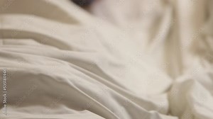 Human corpse covered with a sheet in morgue. Homo dead comprise with sheet. Human corpse covered with bedsheet, in morgue. Death from covid-19 and protection from virus global.