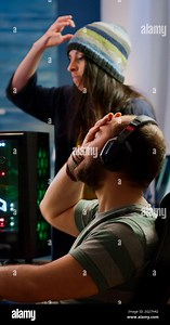 Nervous players couple losing online videogames competition using powerful computer screaming at each other. Streamer gamer playing video games with RGB keyboard performing at gaming turnament Stock Photo - Alamy