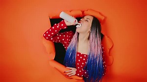 Beautiful Woman Pressing Whipped Cream Into Mouth