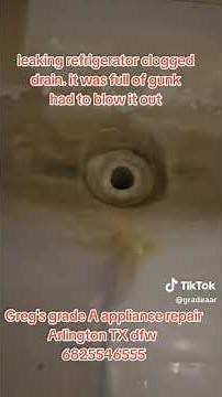 clearing the drain on a leaking whirlpool refrigerator. Greg's grade a appliance repair Arlingtontx