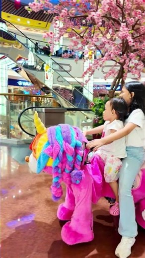 Giera Riding a Zoomoov Unicorn Toy