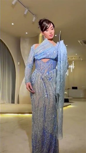 To order this blue dress DM reineecouture A sculpted couture gown featuring a fitted corset bodice