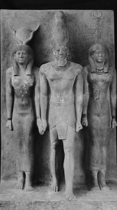 At least 4400 years old, this triad statue is attributed to the 4th Dynasty of Ancient Egypt. Made of graywacke, it depicts Pharaoh Menkaure flanked by what could be the goddess Hathor on his right and the personification of the nome of Diospolis Parva (Sesheshet) on his left. It measures 93 cm (36.6 in) in height and 47 cm (18.5 in) in width. This statue is now housed at the Egyptian Museum in Cairo, Egypt. It was excavated in 1910 by George Andrew Reisner. Special thanks: The Giza Project at H
