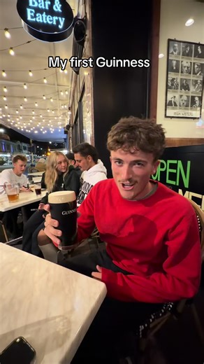 Enjoying Guinness in New Zealand Rain