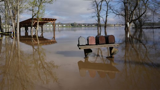 Kentucky watches for surging rivers to recede so cleanup can begin