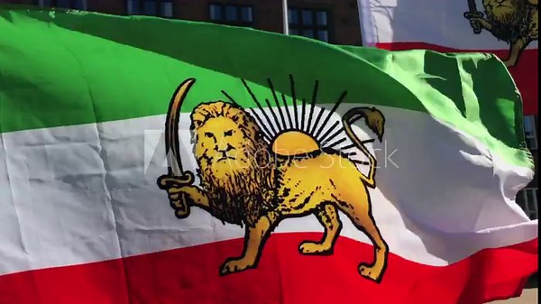 Iran waving pre-revolutionary Lion and Sun flag. Close up film clip. The Lion and Sun symbol dates back to 12th century Persia.