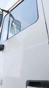 clip-3710536463-truck-driver-sitting-cabin-looking-outside