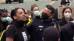 Police officers knelt alongside chanting protesters on Capitol Avenue in Hartford earlier today. The protesters are calling for justice for George Floyd and an end to police brutality. This is one of several peaceful demonstrations that happened across the state. http://nbcct.co/7oNbx9B | NBC Connecticut