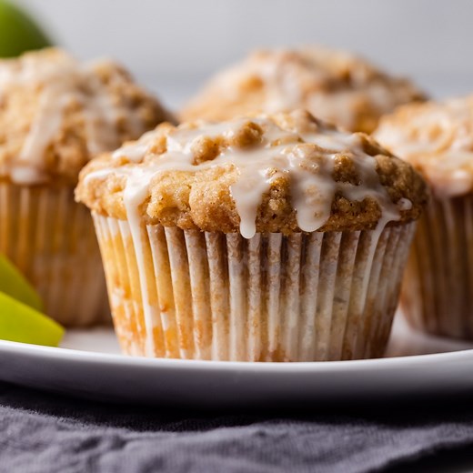 Tender cinnamon apple muffins with streusel topping. YUM! Recipe: https://www.bakedbyanintrovert.com/apple-streusel-muffins/ | Baked by an Introvert