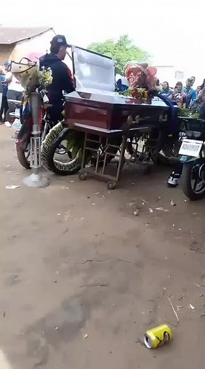 Funeral Procession with Motorcycle and Coffin