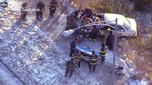 14K views · 355 reactions | SLOW DOWN: Aerial footage shows firefighters pulling a woman from a car dangling over the edge of an icy roadway in Kansas City, Missouri, after a crash as snow and cold continues to cause dangerous driving conditions from the Midwest to the Northeast. https://abcn.ws/2Xa9A6t | ABC World News Tonight with David Muir | Facebook