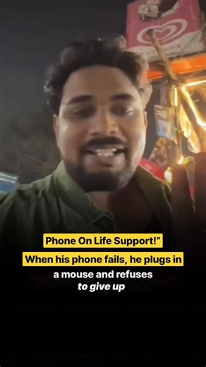 Indiainforms on Instagram: "A man’s determination is winning hearts online after a video showed him using a computer mouse to operate his nearly dead smartphone. With the screen barely responding and the device almost unusable, he refused to give up. Instead of replacing the phone, he connected an external mouse and continued his daily tasks smoothly. The clip has gone viral, sparking conversations about jugaad, resilience, and smart problem-solving in the digital age. Many users praised his cre
