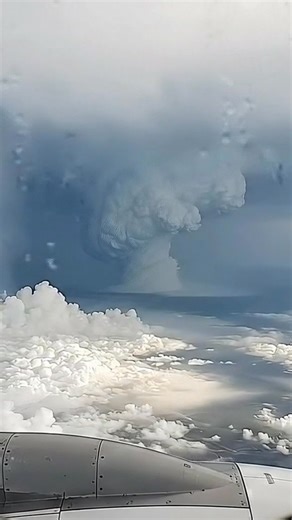 Caught this surreal view of a hurricane from a plane window seat. Clouds twist like a living vortex below, lightning flashing through the storm—totally otherworldly from up here. 🌪️✈️ Click the link on my bio to create videos like this. Made with AI #fblifestyle #hurricane #storm #cloudscape #aerialview #planespotting #weather #aiart #surrealviews | Earth Impacts