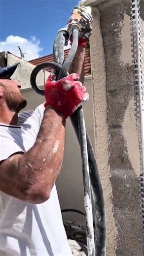 Spraying Wall Plaster Using Machines For Professional Detailed Creative Construction Jobs