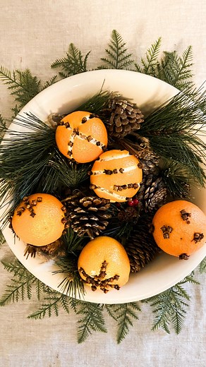 I made some Pomander balls this weekend. This project is super easy. Just take some oranges and stick some cloves in them in any pattern you choose. I also used a citrus peeler to create additional patterns just for fun. They are a great potpourri and look absolutely adorable in a bowl. To dry them out to use in your decor year after year, just put the pomanders in a paper bag to dry out over time. #pomander #driedoranges #christmasdecor #naturalholidaydecor #naturalchristmasdecor | Saving With 