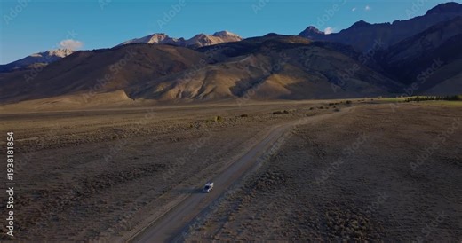 Straight stretch of Highway 93 leading toward Borah Peak in Idaho valley
