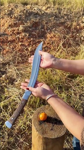 This Rain God Craftsmanship curved knife is hand-forged using traditional Nepalese techniques, combi