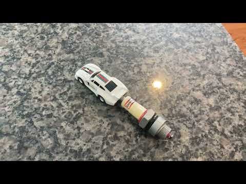 VINTAGE, VERY RARE BANDAI CHAMPION SPARK PLUS SPRING LAUNCHER WITH A DIE-CAST PORSCHE 935. WORKING!!