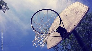 Rusty urban basketball hoop, view from the bottom up. The old basketball hoop outdoors