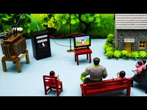 Little people watching little TV Small transformer in a small tractor //