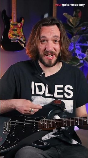 How should I hold my guitar?
