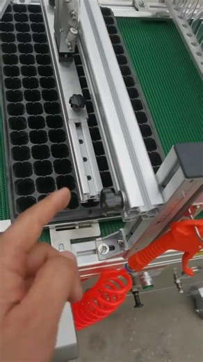 Automatic plug tray seeder designed for efficient and uniform sowing.