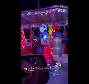 Christmas spirit shines bright on a trailer decked out with lights and festive displays