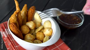 a bowl of kikiam, fish ball and squid ball with sweet chili soy sauce