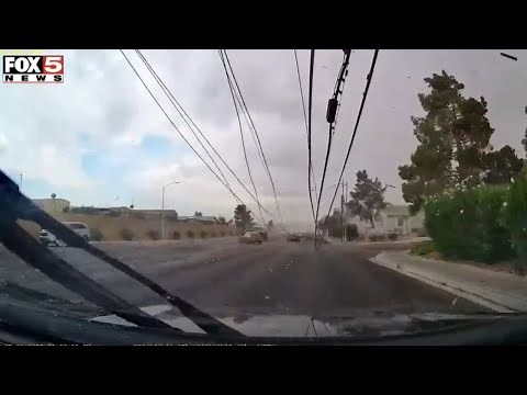 CAUGHT ON VIDEO: Power pole falls on top of car during storm in Las Vegas Valley