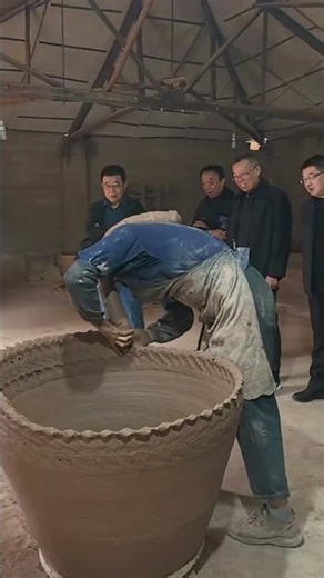 A Master Potter Demonstrates the Traditional Method of Crafting a Giant Clay Vessel
