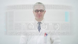 Scientist wearing white lab coat counts to 50 percent on a computer screen