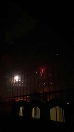 Fireworks in slow motion with Moon beside it