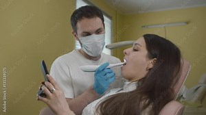 Dentists using intraoral Camera Demonstration Stock Video