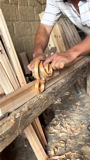 smoothing the wood using a traditional hand plane technique