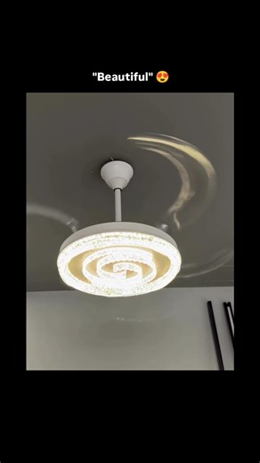 Knowledge | Curiosity | Discovery on Instagram: "The visual content showcases the operational mechanics of a modern retractable ceiling fan featuring an integrated LED crystal light fixture. This sequence highlights the aesthetic utility of invisible fan blades that deploy only when in use, leveraging the psychological appeal of high-tech home automation and sophisticated interior design efficiency. The video aligns with broader trends in smart home technology and minimalist lifestyle gadgets, e