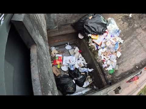 Garbage truck hopper POV: McNeilus ZR dumping trash