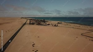 4K aerial drone video of Atlantic Ocean coastline beach, west coast yellow sand dunes landscape, Namib Desert B2 coastal highway between towns Swakopmund and Walvis Bay in Namibia, southern Africa