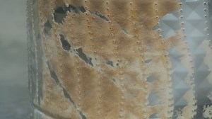 Download Close-up of washing machine drum descaling with high-pressure cleaner. Parts and accessories inside of machine for washing clothes that have been removed to clean and remove dirtdescale. for free