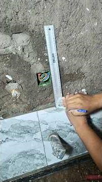 Hole in the electrical switch box around the ceramic tiles