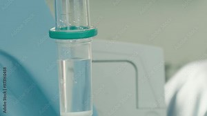 Intravenous drip chamber with medication. Medical equipment provides precise control of fluid administration ensuring patient remains hydrated