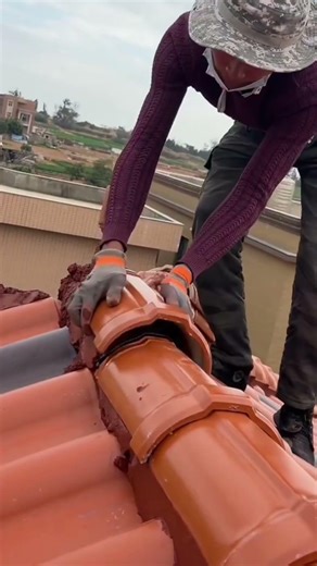 the process of installing roof tiles on a house roof