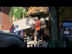 Capitol waste garbage truck on trash cleanup in downtown Boston