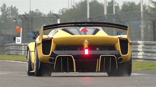 Ferrari FXX-K Evo seen from behind on a racing circuit
