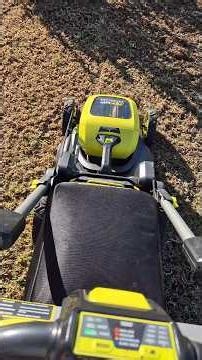 Lawn Reno...Ryobi 36v Mower collecting lawn thatch after scarifiying