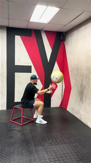 Seated wall facing alternating MB scoop tosses