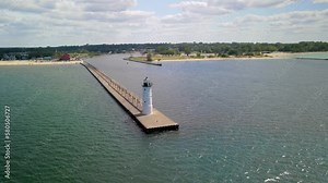 Manistee North Pier Lighthouse at Lake Michigan shore in Manistee, Western Michigan.