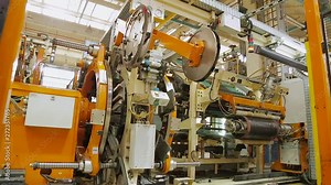 Tires production plant. Car tires automatic building machine in process of tire forming. Production process of tires on modern equipment in the factory. Manufacture of tires.