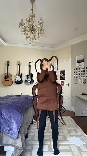 Playful Cockroach Costume Scene in Cozy Bedroom