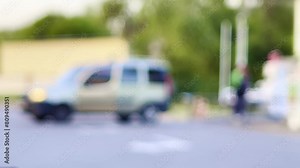 Blurred footage: gas station attendant assists a customer in refueling their car with gas. View of the gas station with the attendant engaged in the refueling process